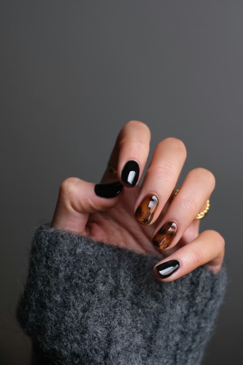 Gel nail art at a Bay Area nail salon — black and tortoiseshell design